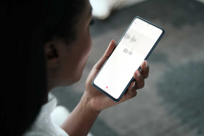 Black,Woman,Using,Application,On,Smartphone,For,Recording,A,Voice