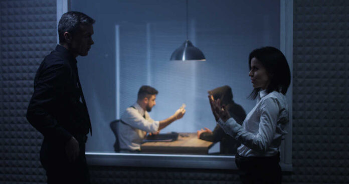 Medium,Shot,Of,A,Male,And,A,Female,Investigator,Watching