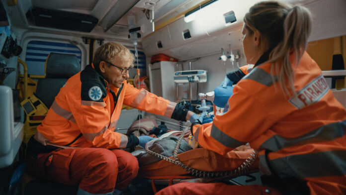 Ems,Paramedics,Team,Provide,Medical,Help,To,Injured,Patient,On