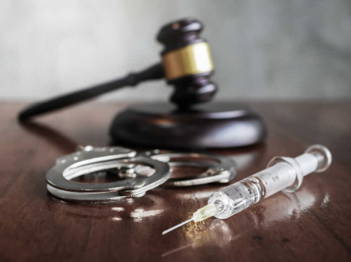 Judges,Gavel,And,Syringe,Injection,On,Wooden,Table,,Executed,By