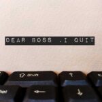 "Dear Boss, I quit" note on keyboard.