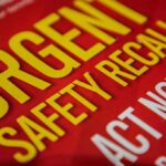 Critical Vehicle Recalls: Major Safety Issues Found in Popular Cars and Trucks "Urgent safety recall sign in bold letters."