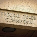 "Federal Trade Commission sign on building facade."
