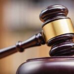 Judge's gavel striking a sound block.