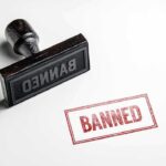 Stamp marked "BANNED" on white background.