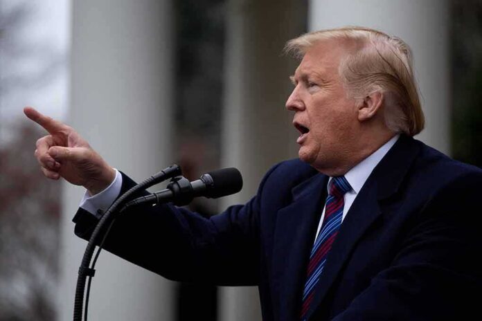1276349383 featured image Man speaking at microphone with finger pointing forward