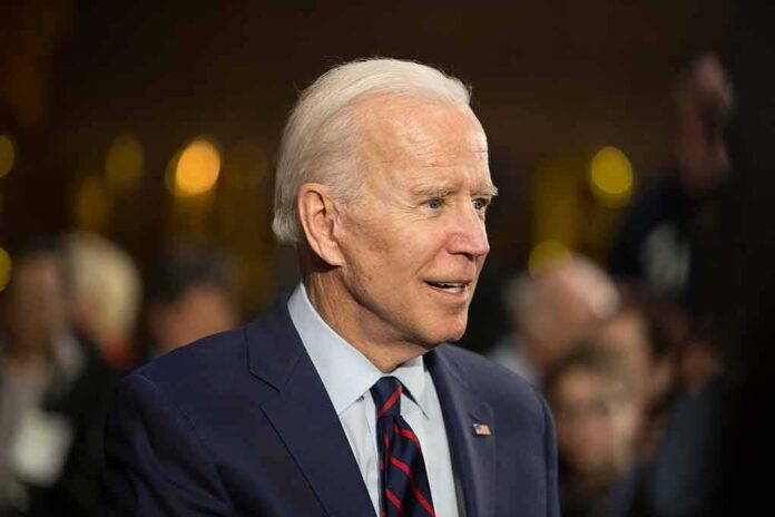 1786934054 featured image Elderly man in suit with crowd in background.