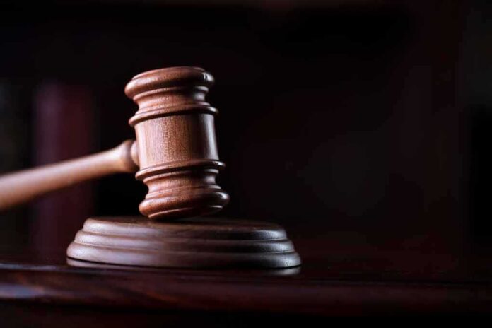 1917623645 featured image Wooden gavel on a dark background.