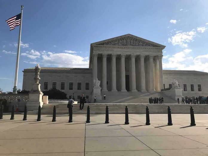2453289175 featured image Supreme Court building with flag and people outside.