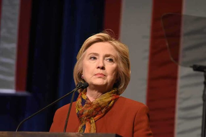378987877 featured image Person speaking at a podium with flag background.