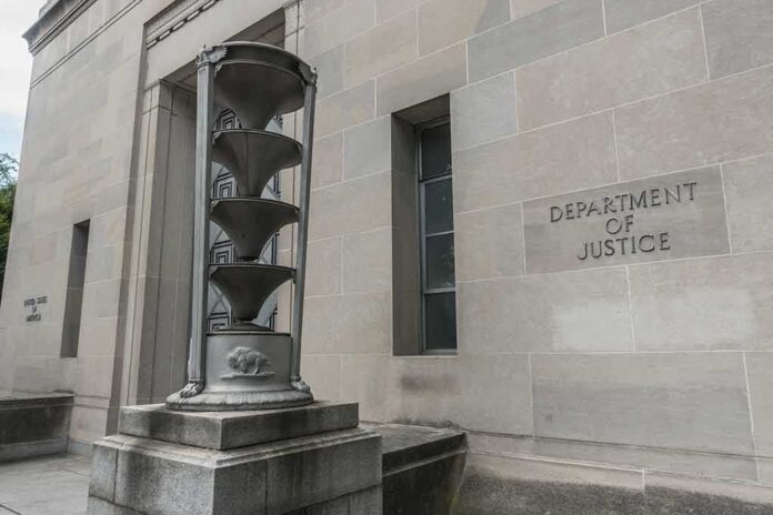 654256021 featured image Department of Justice building with sculpture outside.