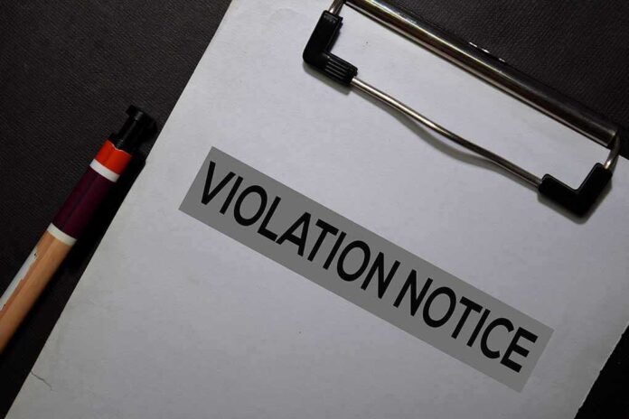 1612428013 featured image Violation notice on clipboard beside pen.
