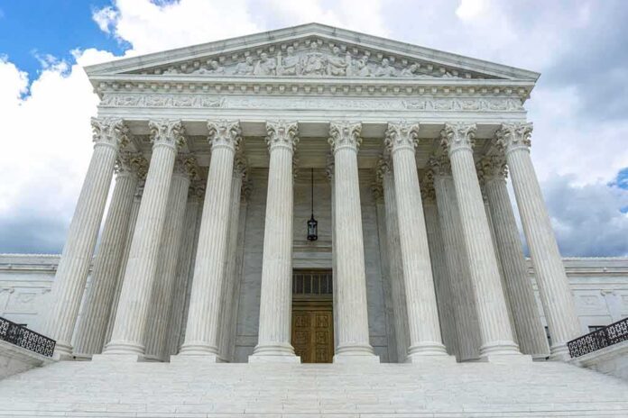 1714955683 featured image Building with columns under a cloudy sky.