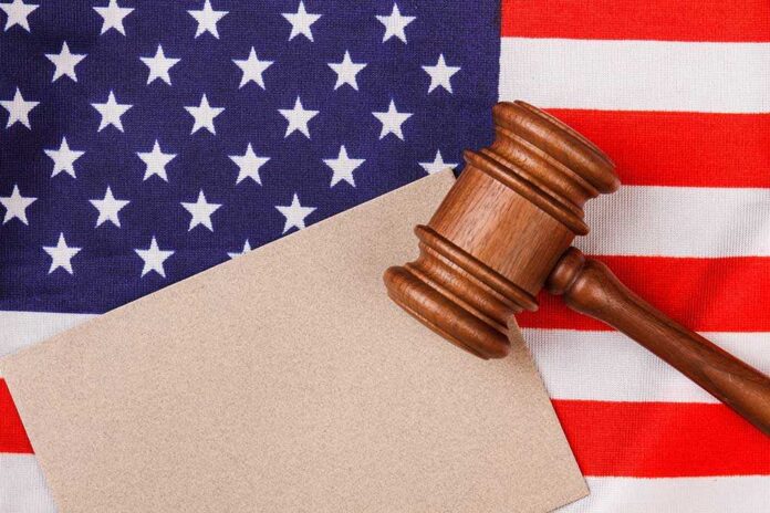 1906964248 featured image Gavel on American flag with blank paper