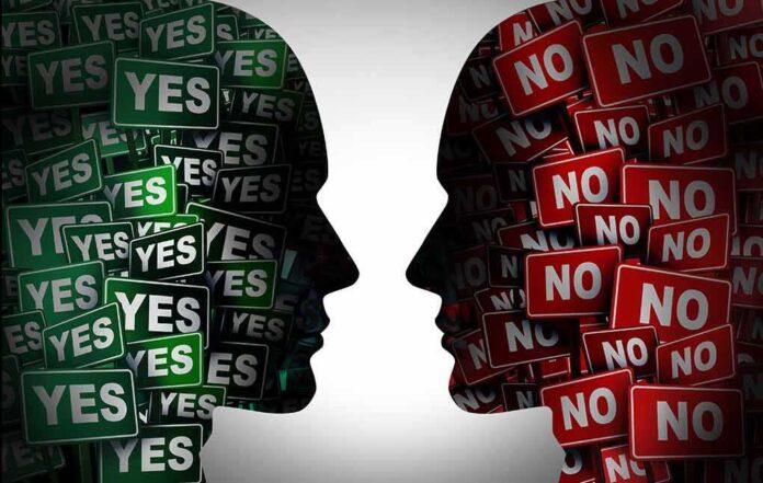 1994812379 featured image Silhouettes filled with "YES" and "NO" signs facing each other.