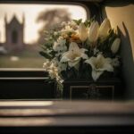 White flowers in a car with blurred background.