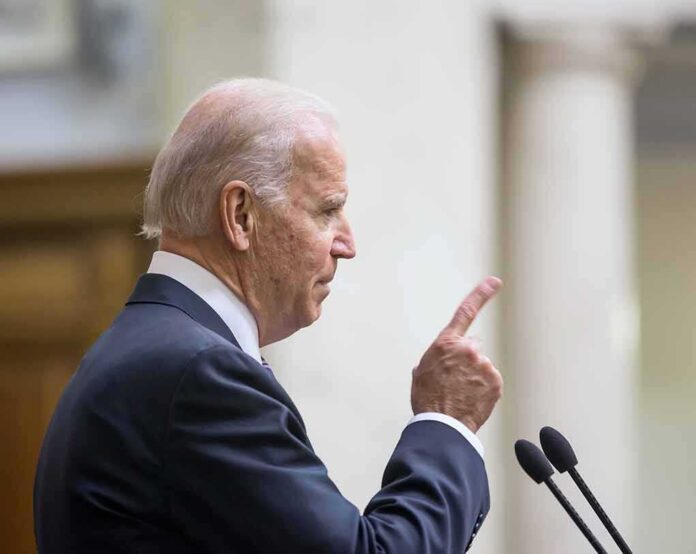 348822887 featured image Man in suit pointing while speaking at podium.