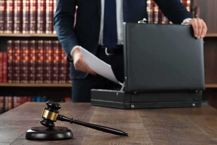 360047027 featured image Gavel and person opening briefcase in law office