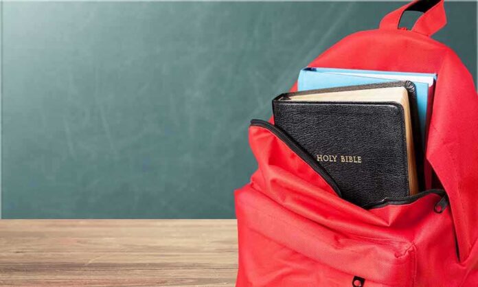 1183389583 featured image Red backpack with a Bible and books inside