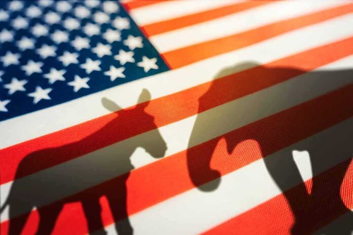 2193751699 featured image Donkey and elephant shadows on American flag.
