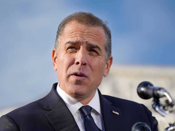 2478300523 featured image Man in suit speaking at a microphone podium.