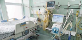 Hospital bed in ICU with monitoring equipment