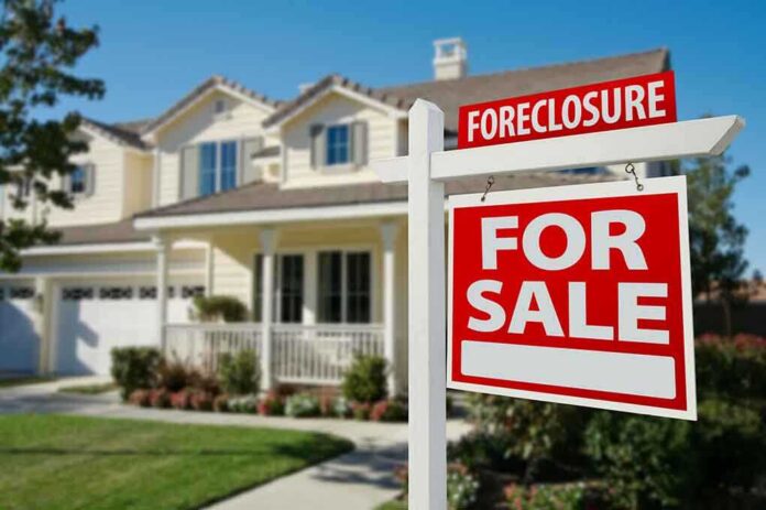 50097061 featured image House for sale with foreclosure sign