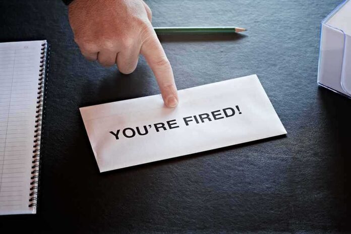 Envelope with YOU ARE FIRED and pointing finger
