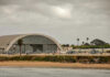 Aircraft hangar with helicopters near the beach