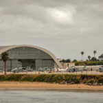 Aircraft hangar with helicopters near the beach