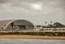 Aircraft hangar with helicopters near the beach