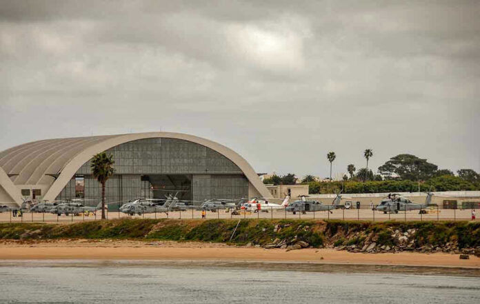 Aircraft hangar with helicopters near the beach