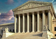 Building with columns and statues in front of entrance