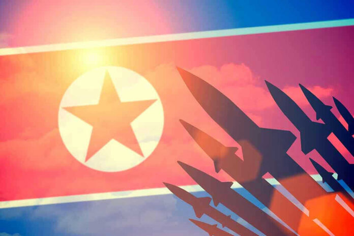 395414536 North Korean flag with missile silhouettes