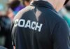 Person wearing a shirt labeled Coach