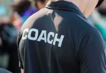Person wearing a shirt labeled Coach