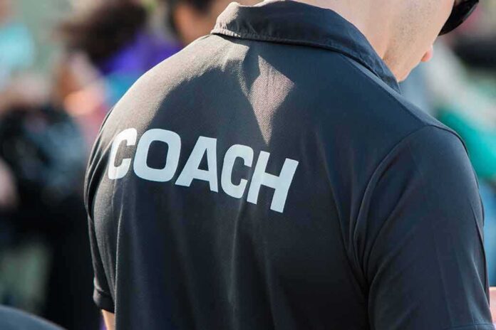 582703915 featured image Person wearing a shirt labeled Coach