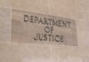 Department of Justice sign on a building