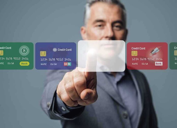 737497186 featured image Man interacting with virtual credit card interface