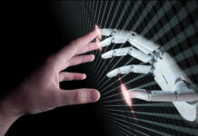 Human and robotic hands almost touching fingers
