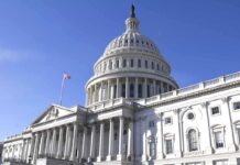 The US Capitol building with a clear blue sky in the background