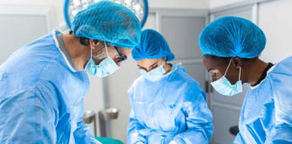 Surgeons performing an operation in a sterile environment.