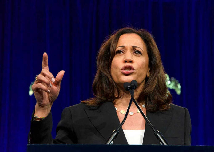Woman speaking passionately at a podium gesturing upward