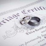 Wedding rings placed on a marriage certificate