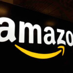 Amazon’s Fumbles Mass Layoff Plan – Disaster Just Leaked! Amazon logo with yellow curved arrow underneath.