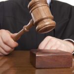 Judge SHUTS DOWN Democrats’ Power-Grab Redistricting Scheme A judge holding a gavel above a wooden block