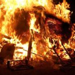 Fire KILLS 40, Injures 119 – Shocking Cause Identified! A large fire engulfing debris at night