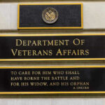 VA DENYING Veterans Essential Care Department of Veterans Affairs building sign with quote.