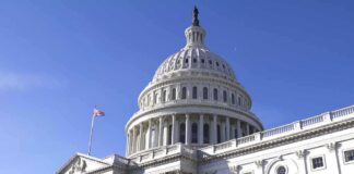 The U.S. Capitol building with a clear blue sky in the background