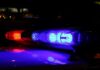 Racist Livestreams Courthouse Gunfight! Close-up of police lights flashing in blue and red at night